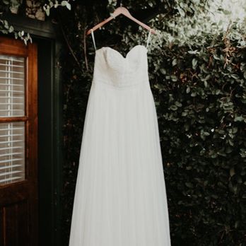 Wedding dress hanging — before alteration