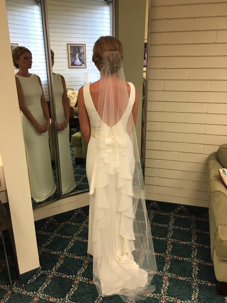 Client fitting at Kiki's Alterations shop