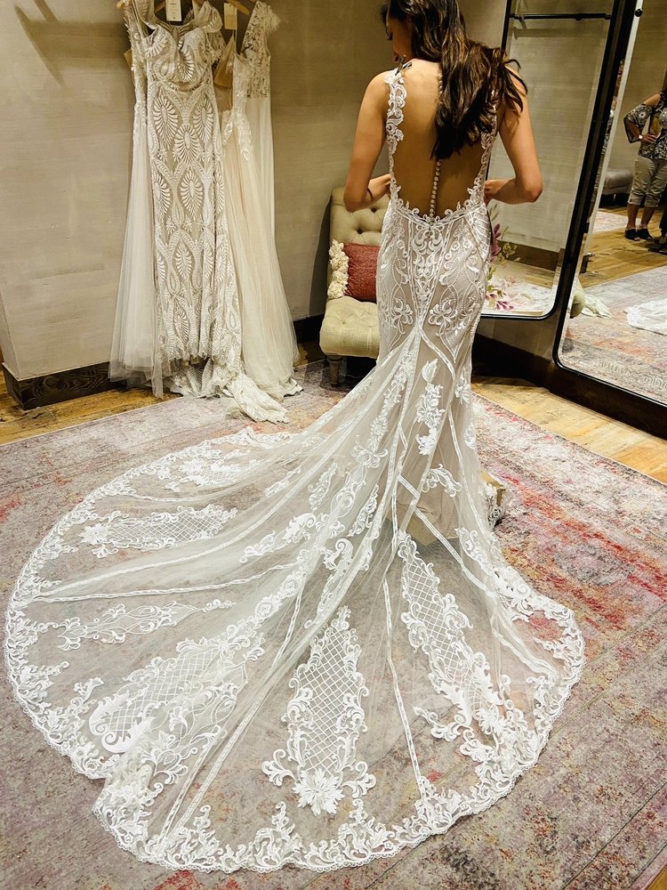 Elegant off-shoulder bridal gown with floral appliqué