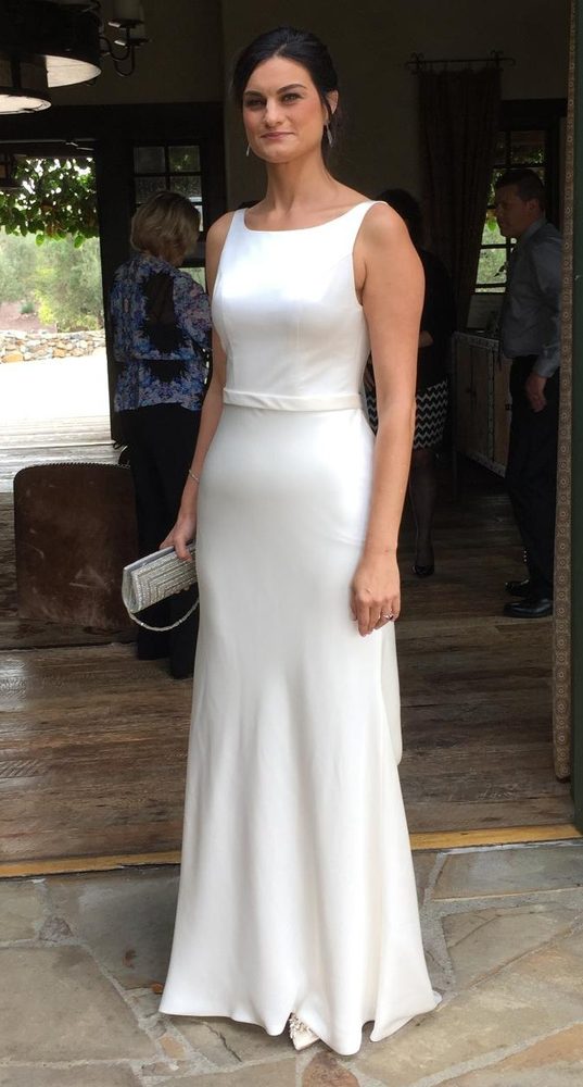 Bride with bridesmaids showing altered gowns